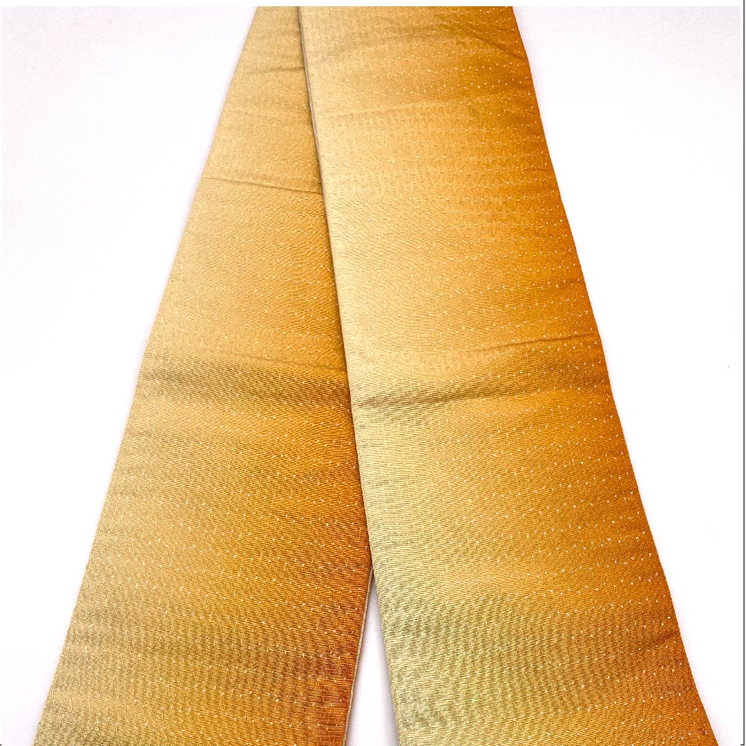半幅帯 ポリエステル 人参色(にんじんいろ) ギザギザ模様 幾何学模様 グラデーション 帯丈396cm 橙系 Sランク 1125001152326
