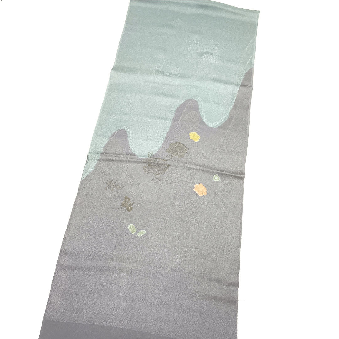 Semi-formal obiage (sash) made of pure silk, grade A, in dull purple with a classic two-tone floral pattern. Approximately 184cm long, 32cm wide, gray tones. Product code: 1136001583922