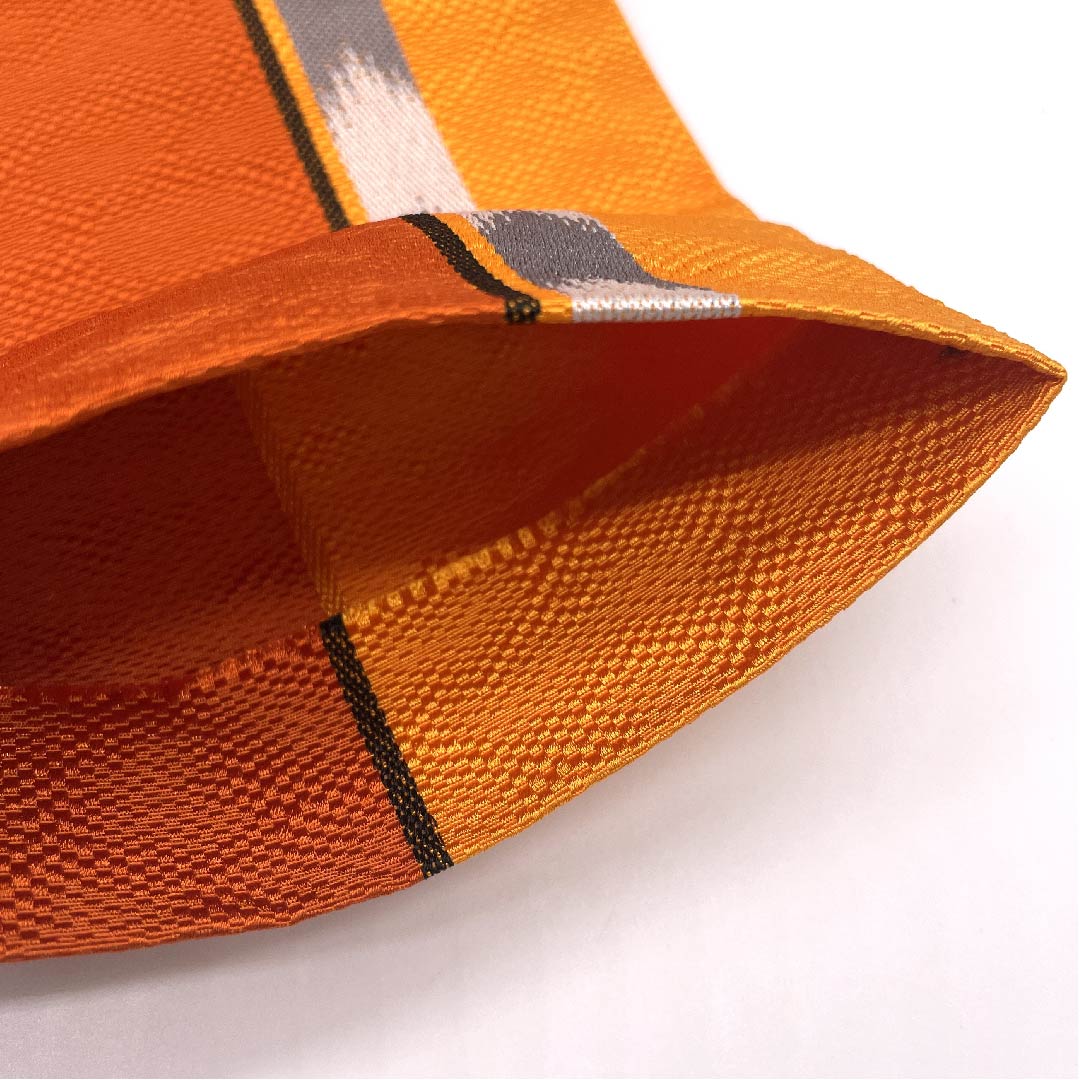 (未仕立)半幅帯 ポリエステル 銀朱色(ぎんしゅいろ) 橙色(だいだいいろ) 矢絣 幾何学模様 帯丈394cm 橙系 Sランク 1125001252326