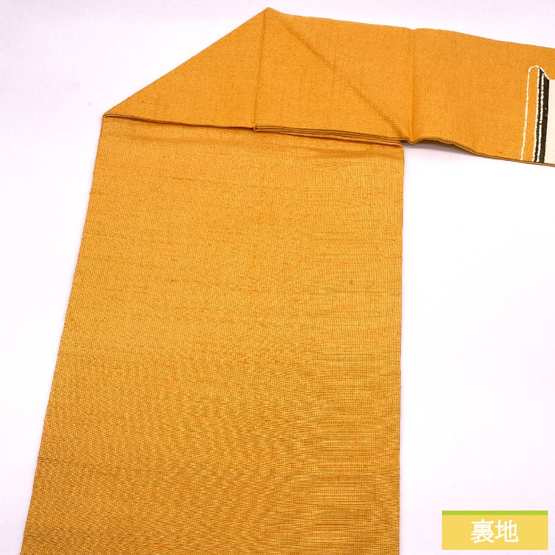 名古屋帯 忘れ草色 型染 鶴 紬地 帯丈362cm 正絹 Sランク ポイント柄 カジュアル 橙系 1124005482326 名古屋仕立て