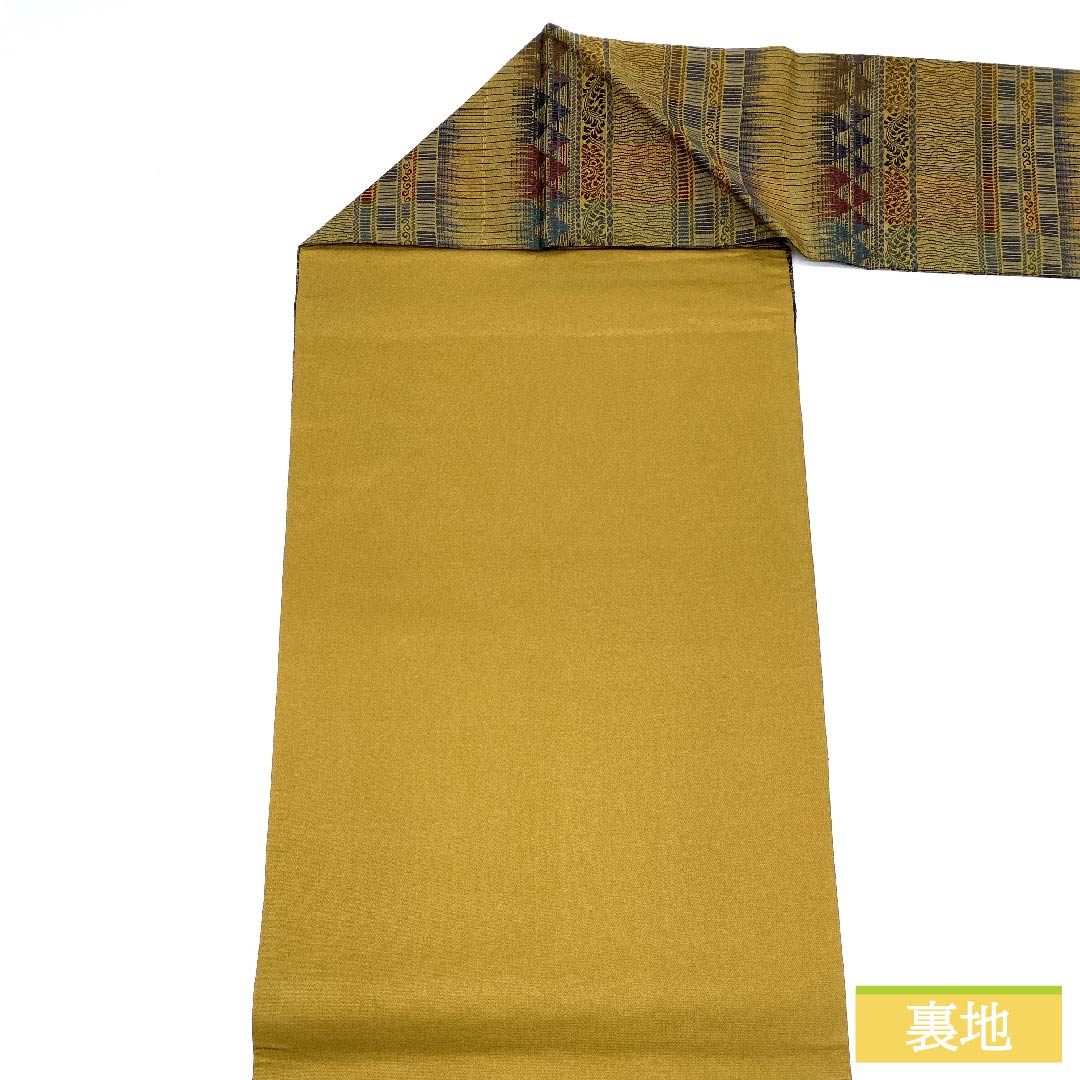 名古屋帯 正絹 木蘭色色(もくらんじきいろ) 幾何学模様 長尺 帯丈370cm Sランク 全通 カジュアル 茶系 1124006302314 名古屋仕立て
