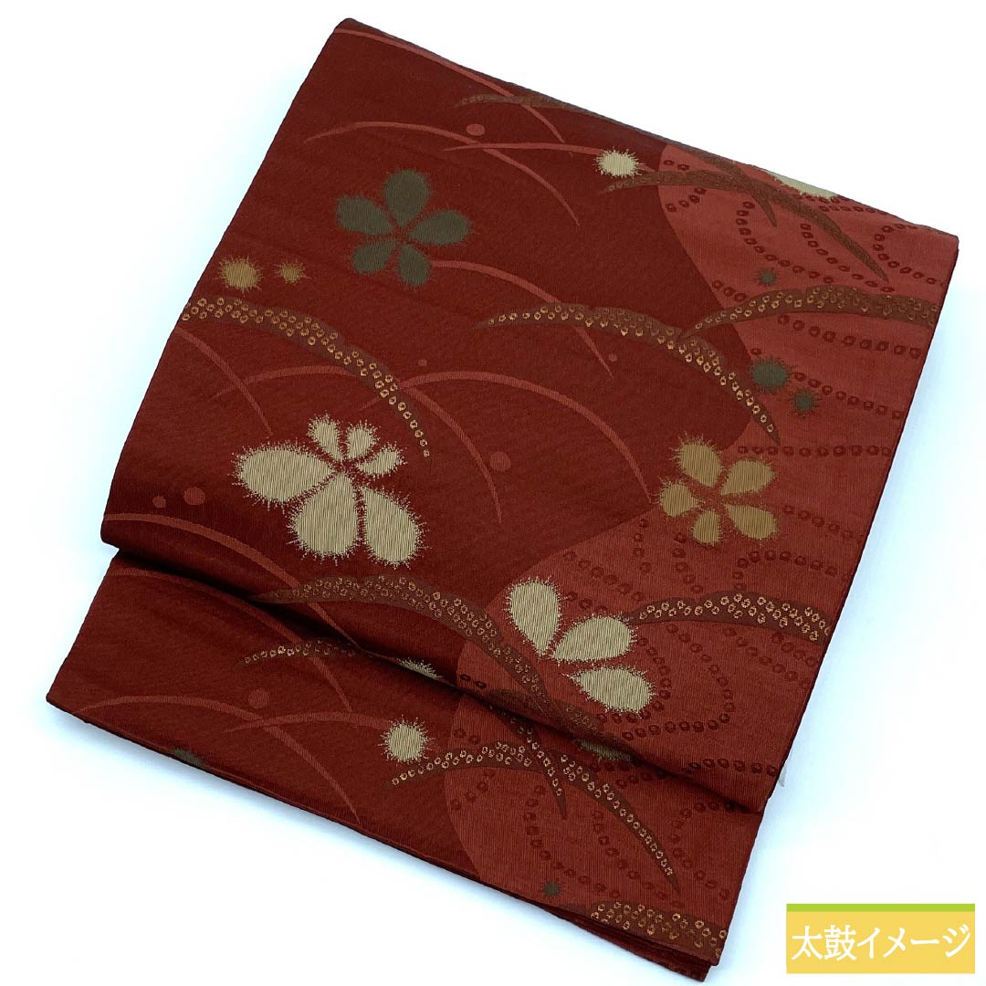 （京袋帯）名古屋帯 ポリエステル Aランク 赤銅色（しゃくどういろ） 京袋帯 露芝 花模様 帯丈364cm 六通 カジュアル 朱系 1124010653316 開き仕立て