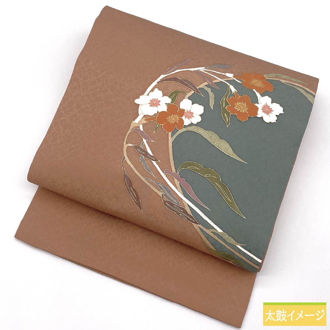 リサイクル着物】名古屋帯 緋褪色（ひさめいろ） 染め帯 花模様
