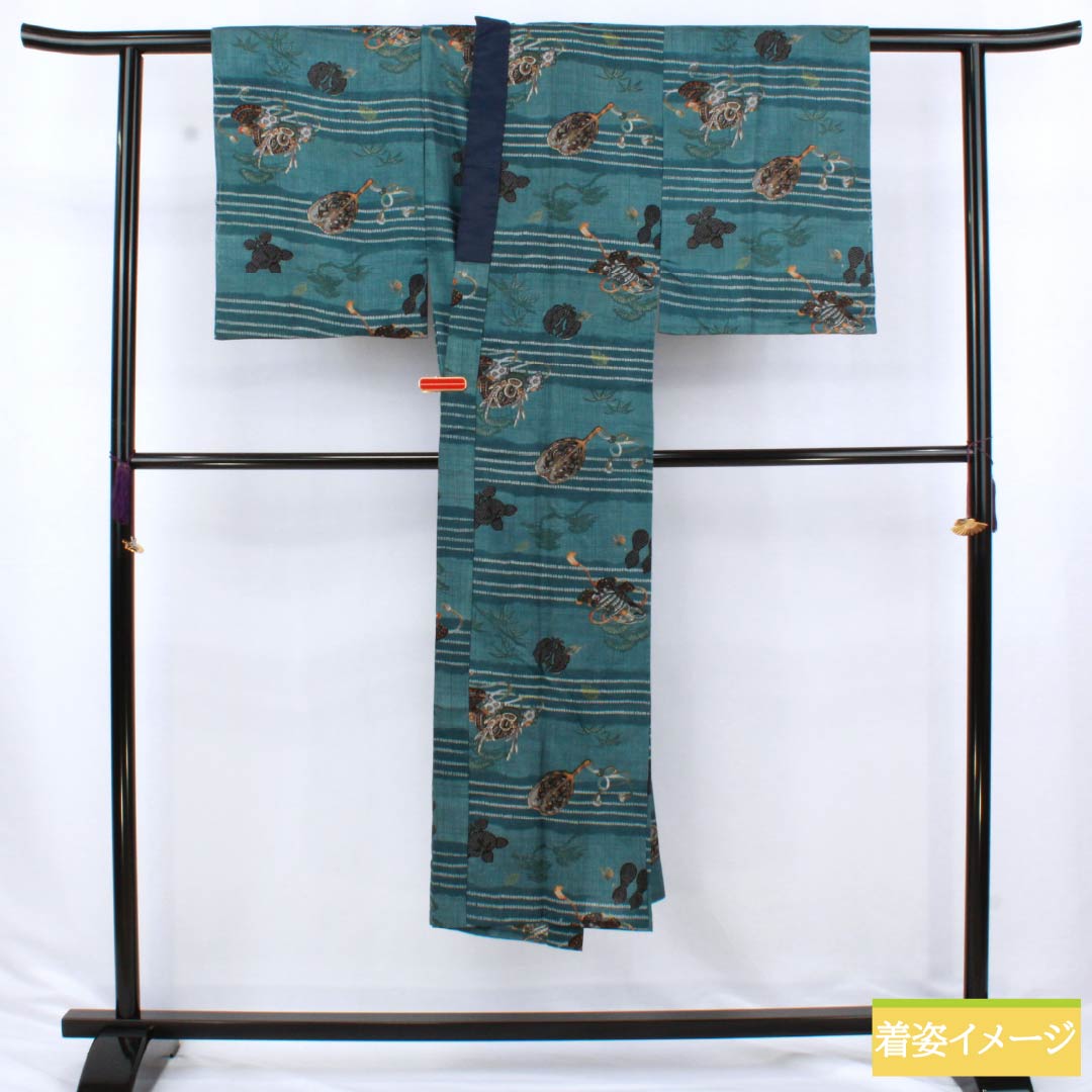 Men's wool nagajuban (long under-kimono), S-rank, length 138cm, sleeve length 65.5cm, indigo brown (aito-chairo) color, with a helmet, pine, and bamboo motifs, single-layer, blue-based design, product number 1140000742317