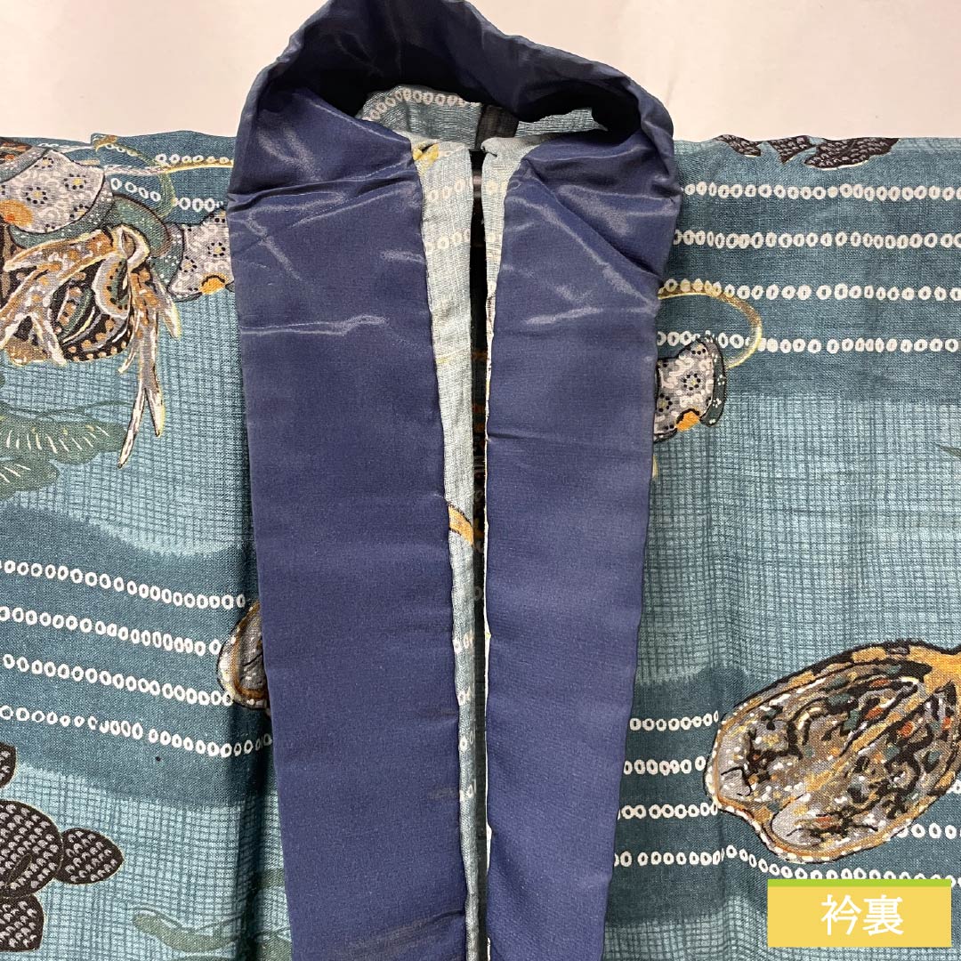 Men's wool nagajuban (long under-kimono), S-rank, length 138cm, sleeve length 65.5cm, indigo brown (aito-chairo) color, with a helmet, pine, and bamboo motifs, single-layer, blue-based design, product number 1140000742317