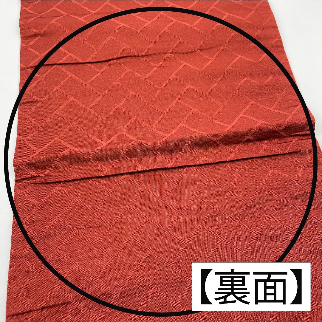 （京袋帯）名古屋帯 ポリエステル Aランク 赤銅色（しゃくどういろ） 京袋帯 露芝 花模様 帯丈364cm 六通 カジュアル 朱系 1124010653316 開き仕立て