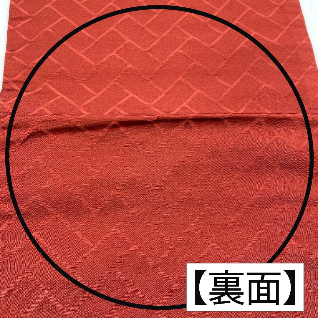 （京袋帯）名古屋帯 ポリエステル Aランク 赤銅色（しゃくどういろ） 京袋帯 露芝 花模様 帯丈364cm 六通 カジュアル 朱系 1124010653316 開き仕立て